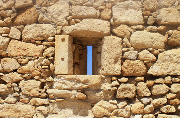 Window in old stone wall ruins