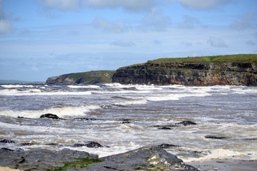 Fototapeta na wymiar big waves and cliffs on the wild atlantic way