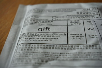 Fototapeta premium Large caption Gift on the white envelope sent from China, in letters and Chinese symbols