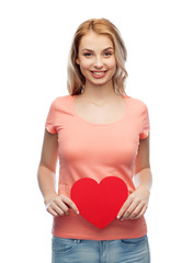 happy woman or teen girl with red heart shape