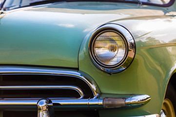 Fototapeta premium Close-up detail of vintage car. Headlight of retro car. Selective focus.