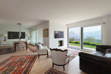 Living room with white armchairs