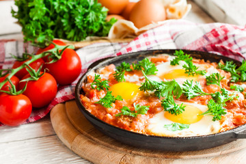 fried eggs in tomato sauce, shakshuka