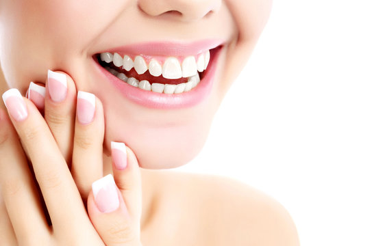 Cheerful female with fresh clear skin, white background