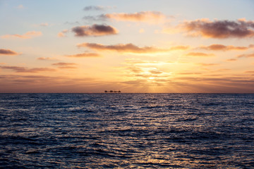 Oil platform in USA at sunset