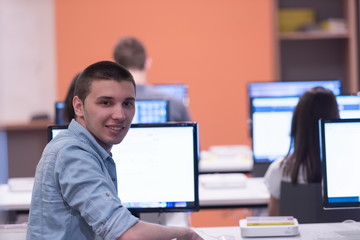 technology students group working in computer lab school  classr