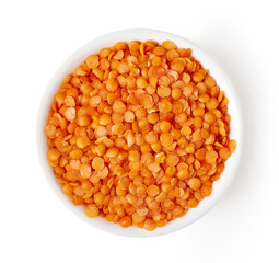 Bowl of red lentils isolated on white, from above