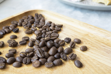 Coffee beans with wood background