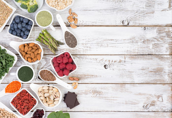 Healthy food called super foods on white, wooden background, top view