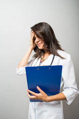 Fototapeta premium Woman doctor holding a document