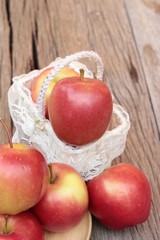 red apples is delicious on wood background.