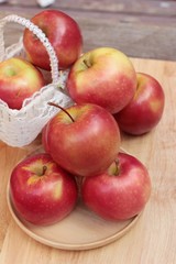 red apples is delicious on wood background.