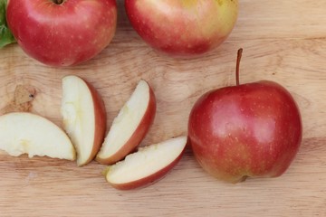 red apples is delicious on wood background.