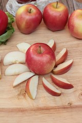 red apples is delicious on wood background.