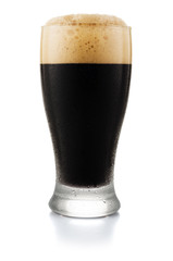 Glass of dark beer isolated on white background