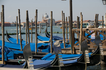 Gondolas moored at port in Venice, Italy.