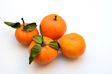 Orange with leaf on white background