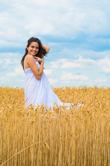 young woman in wheat field