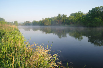Morning landscape with fog on the river