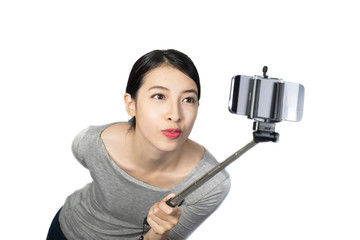 Happy woman with smartphone selfie stick 1
