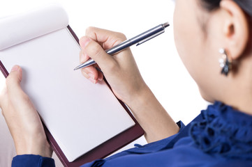 Close-up of female hand holding a pen and writing 1