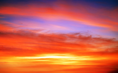 Fiery orange sunset sky. Beautiful sky background.