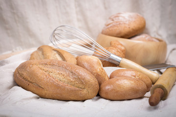 Fresh homemade bread in a cotton cloth background