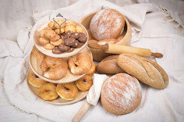 Fresh homemade bread in a cotton cloth background