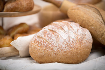 Fresh homemade bread in a cotton cloth background