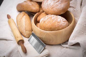 Fresh homemade bread in a cotton cloth background