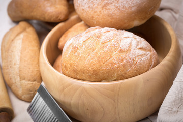 Fresh homemade bread in a cotton cloth background
