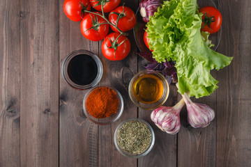 fresh vegetables and olive oil over white