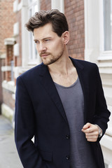 Naklejka premium Handsome dude looking away in suit jacket