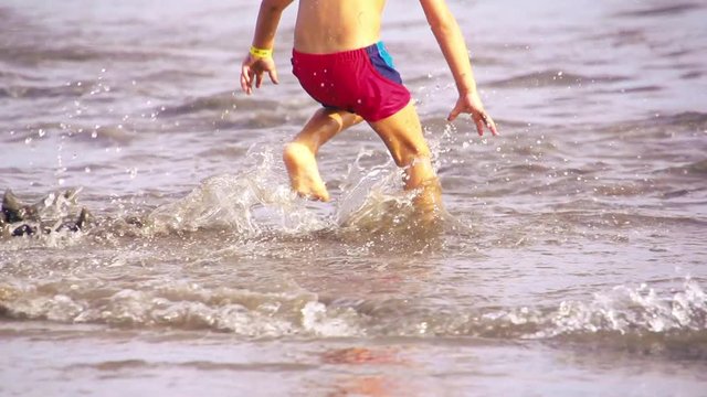 Kid playing in the beach

