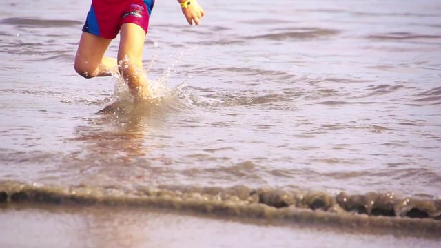 Kid playing in the beach
