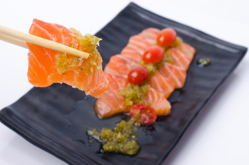 Slices of Salmon Served with Spicy Sauce