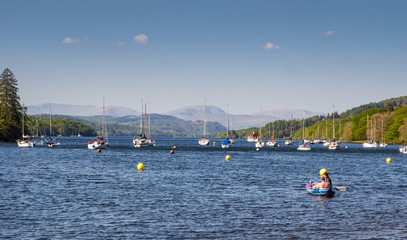 Fototapeta na wymiar Lake Windermere, Cumbria, UK. May 9th 2016. Sailing boats and pleasure craft at Fell Foot