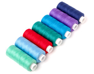 colored thread for sewing isolated on white background