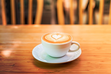 hot coffee on wood background at coffee shop