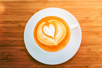 hot coffee on wood background at coffee shop