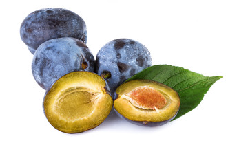 Fresh plums with leaf on white background.