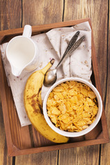 Tasty and healthy breakfast on wooden tray