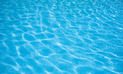 Obraz na płótnie Canvas Ripple Water in swimming pool witn sun reflection