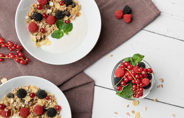 Naklejka na ściany i meble Healthy breakfast with yogurt, muesli, raspberry and cherries