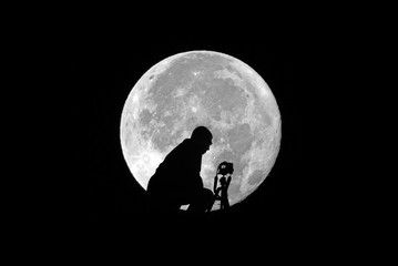 Photographer and moon