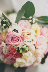 Pretty good wedding bouquet of various flowers with rings