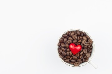 Freshly roasted coffee beans, packed in a cup. We like strong coffee. Sales of fresh coffee. Advertising on a cafe.
