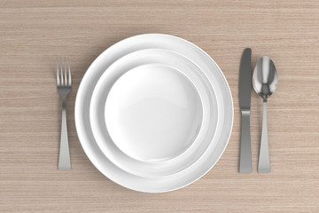 three empty plates, spoon, fork and knife