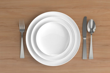 three empty plates, spoon, fork and knife