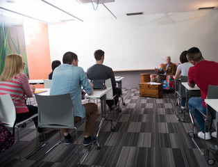 teacher with a group of students in classroom